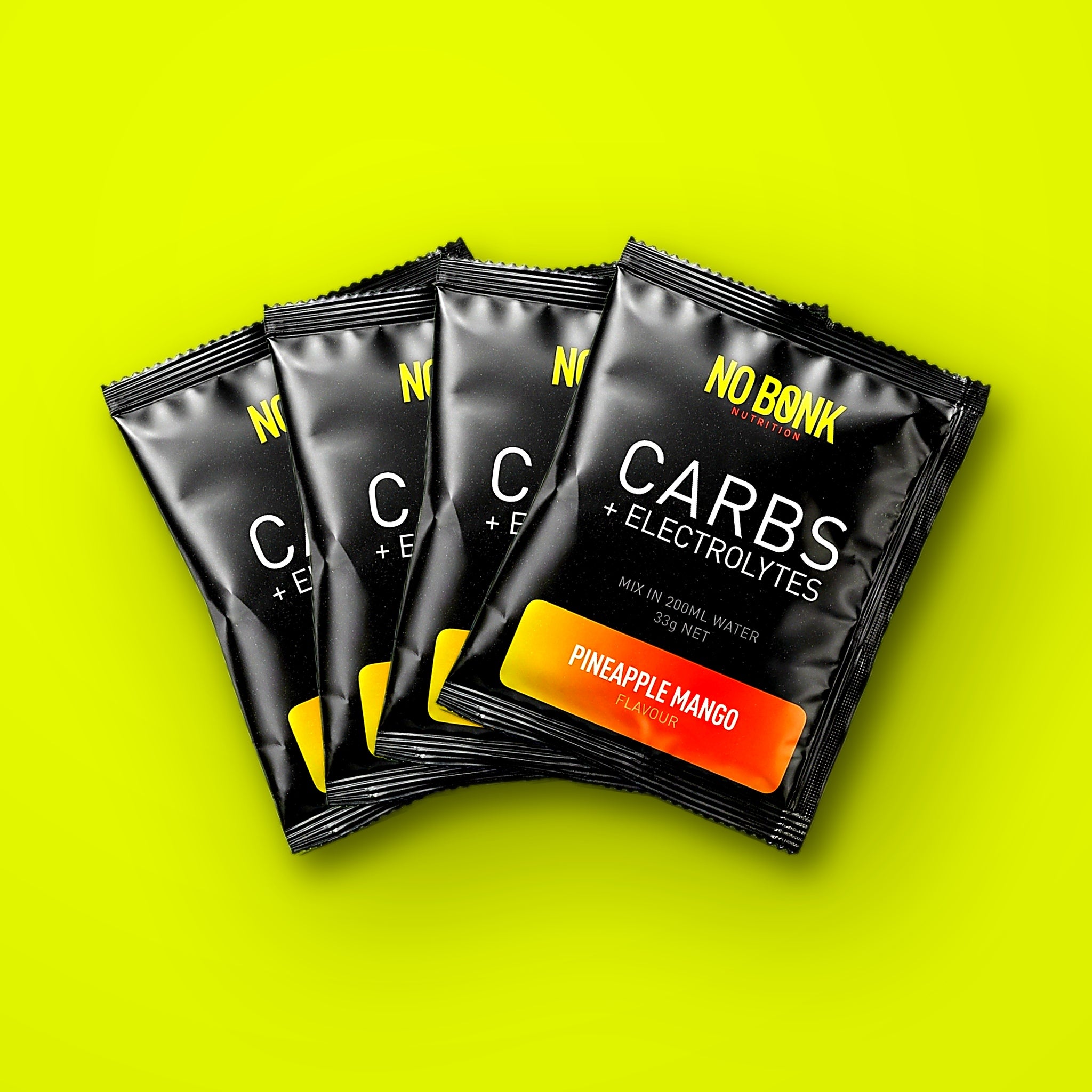 Four NOBONK Pineapple Mango sachets fanned out on a chartreuse background
