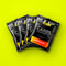Four NOBONK Pineapple Mango sachets fanned out on a chartreuse background